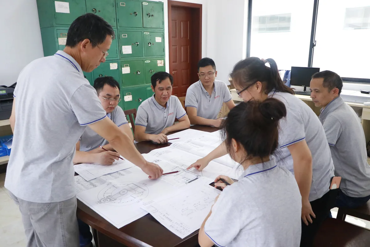 Cronus engineering team reviewing technical drawings