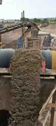 Mineral feed moving through an industrial processing line